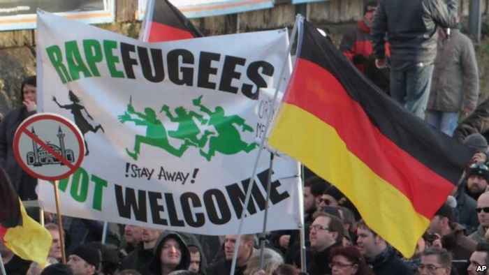 Protest in Germany - banner with the text 'Rapefugees Not Welcome'