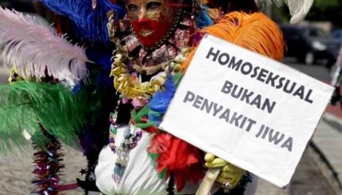 Protestor with sign 'homosexuality is not a mental illness'